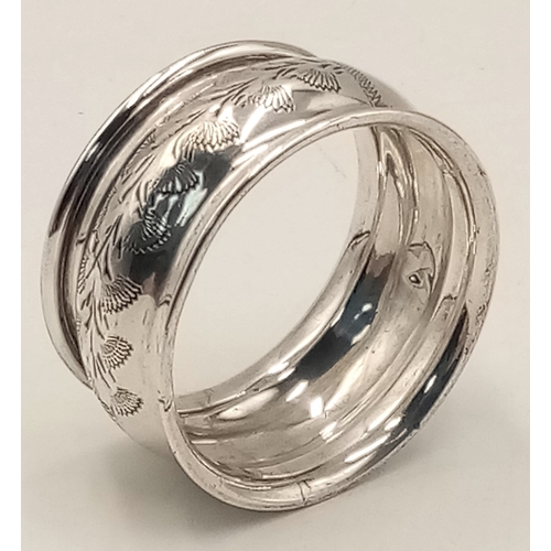 1705 - An antique sterling silver napkin holder with floral motive engravings. Full Birmingham hallmarks, 1... 