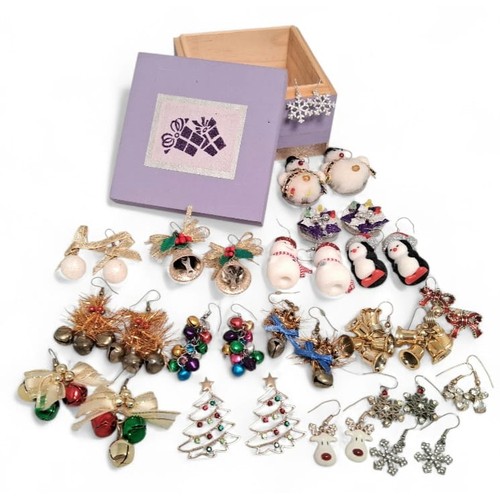 647 - A Collection of 16 Pairs of Novelty Christmas Earrings. Presented in a present decorated wooden box.