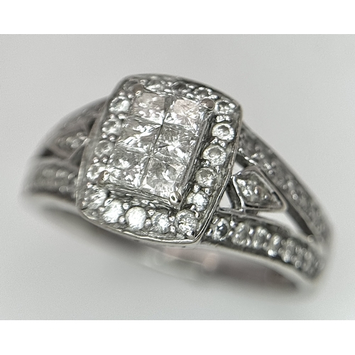 724 - An Art Deco Style, 14K White Gold Diamond Cluster Ring. Set with c. 0.75ctw of high grade Princess a... 