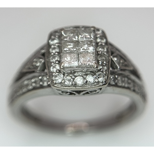 724 - An Art Deco Style, 14K White Gold Diamond Cluster Ring. Set with c. 0.75ctw of high grade Princess a... 