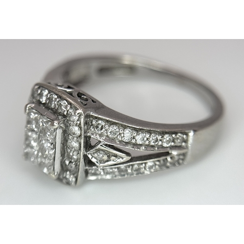 724 - An Art Deco Style, 14K White Gold Diamond Cluster Ring. Set with c. 0.75ctw of high grade Princess a... 