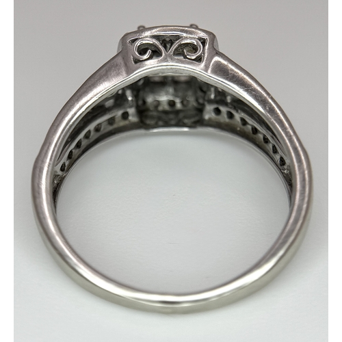 724 - An Art Deco Style, 14K White Gold Diamond Cluster Ring. Set with c. 0.75ctw of high grade Princess a... 