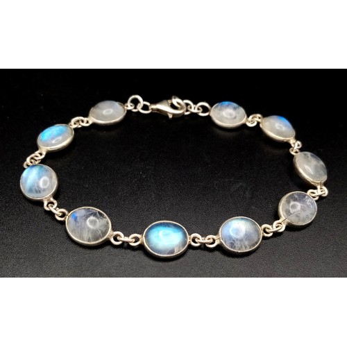 515 - A Very Attractive Sterling Silver and Moonstone Set Tennis Bracelet- 20.5cm Length. Set with Ten 1cm... 