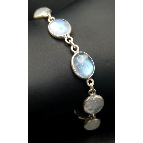 515 - A Very Attractive Sterling Silver and Moonstone Set Tennis Bracelet- 20.5cm Length. Set with Ten 1cm... 