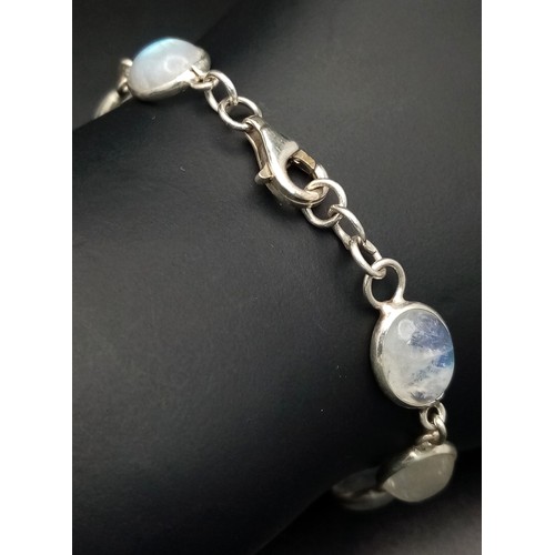515 - A Very Attractive Sterling Silver and Moonstone Set Tennis Bracelet- 20.5cm Length. Set with Ten 1cm... 
