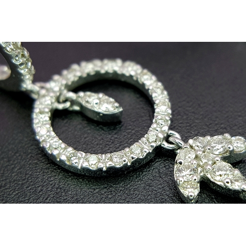 774 - An Art Deco Style Pair of 18K White Gold, Pave Diamond Circle Drop Earrings. 6cm drop. 15.8g. Ref: 2... 