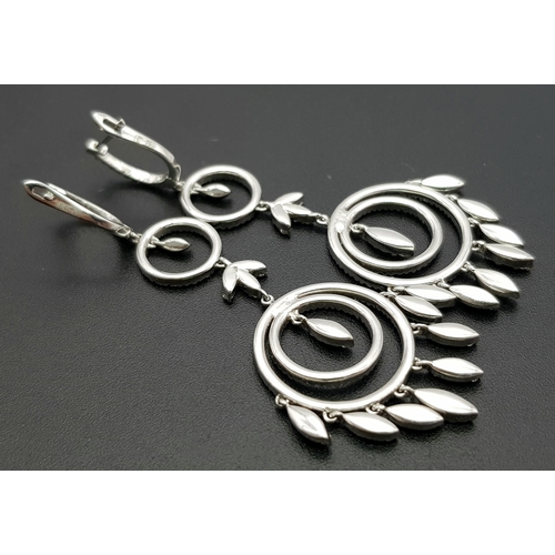 774 - An Art Deco Style Pair of 18K White Gold, Pave Diamond Circle Drop Earrings. 6cm drop. 15.8g. Ref: 2... 