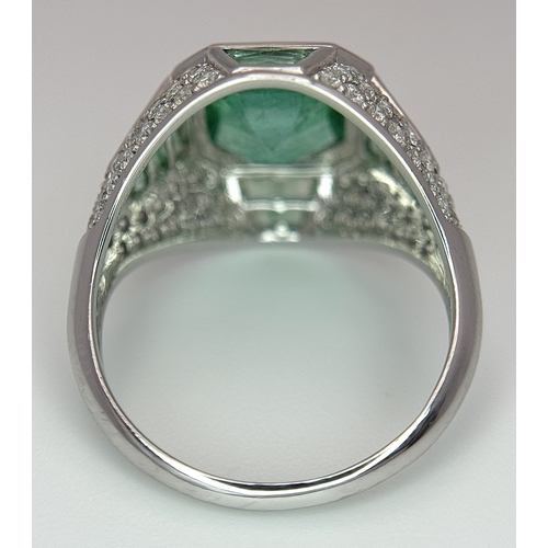 1572 - A Stunning W.G.I Certified 18K White Gold, Emerald and Diamond Ring. A 2.05ct Brazilian octagonal st... 