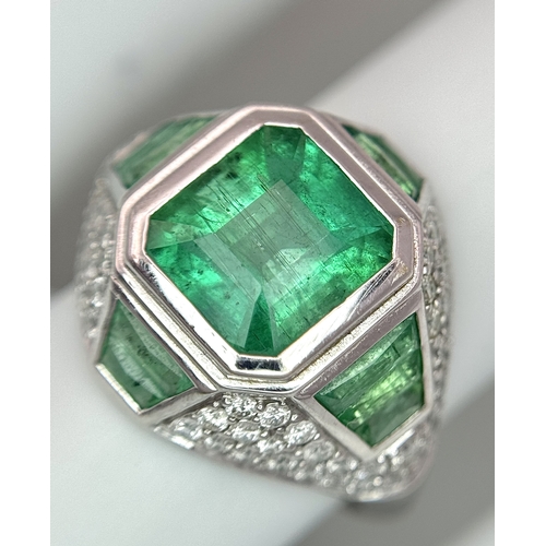 1572 - A Stunning W.G.I Certified 18K White Gold, Emerald and Diamond Ring. A 2.05ct Brazilian octagonal st... 