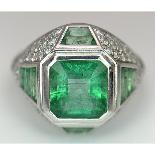 1572 - A Stunning W.G.I Certified 18K White Gold, Emerald and Diamond Ring. A 2.05ct Brazilian octagonal st... 