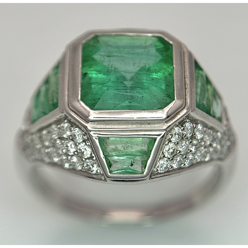 1572 - A Stunning W.G.I Certified 18K White Gold, Emerald and Diamond Ring. A 2.05ct Brazilian octagonal st... 