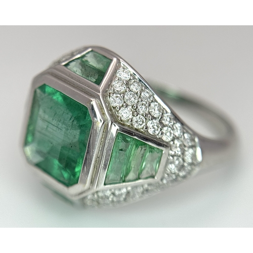 1572 - A Stunning W.G.I Certified 18K White Gold, Emerald and Diamond Ring. A 2.05ct Brazilian octagonal st... 