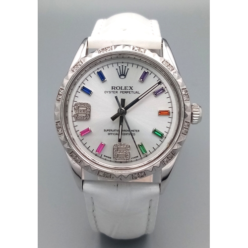 310 - A VERY SPECIAL ROLEX OYSTER PERPETUAL WITH DIAMOND BEZEL AND GEMSTONE NUMERALS, CUSTOM MADE AND COMI... 