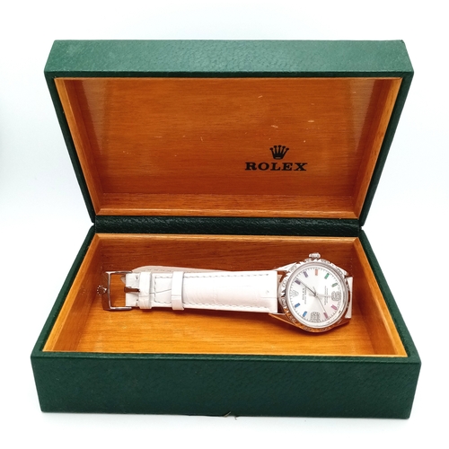 310 - A VERY SPECIAL ROLEX OYSTER PERPETUAL WITH DIAMOND BEZEL AND GEMSTONE NUMERALS, CUSTOM MADE AND COMI... 