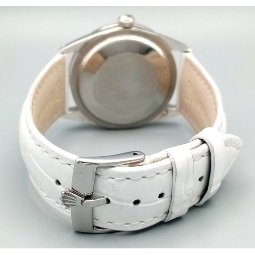 310 - A VERY SPECIAL ROLEX OYSTER PERPETUAL WITH DIAMOND BEZEL AND GEMSTONE NUMERALS, CUSTOM MADE AND COMI... 