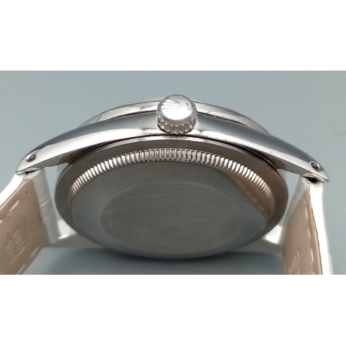 310 - A VERY SPECIAL ROLEX OYSTER PERPETUAL WITH DIAMOND BEZEL AND GEMSTONE NUMERALS, CUSTOM MADE AND COMI... 