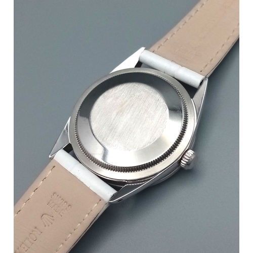 310 - A VERY SPECIAL ROLEX OYSTER PERPETUAL WITH DIAMOND BEZEL AND GEMSTONE NUMERALS, CUSTOM MADE AND COMI... 