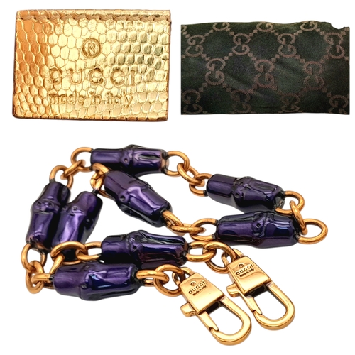 37 - A Gucci Gold Lizard-Effect Clutch with Jewelled Snake Handle. Gold metallic lizard-embossed leather ... 