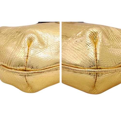 37 - A Gucci Gold Lizard-Effect Clutch with Jewelled Snake Handle. Gold metallic lizard-embossed leather ... 