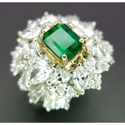 A W.G.I Certified 18K White Gold, Emerald and Diamond Dress Ring. Central Colombian 1.4ct octagonal step cut emerald with a mixture of 28 (total) marquise, pear, round and tapered baguette cut diamond surround - 3.5ctw. VS1/2 clarity. Size N. 9.63g total weight.