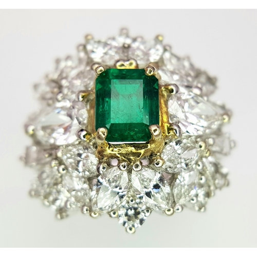 1771 - A W.G.I Certified 18K White Gold, Emerald and Diamond Dress Ring. Central Colombian 1.4ct octagonal ... 