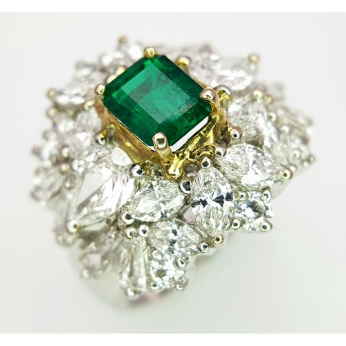 1771 - A W.G.I Certified 18K White Gold, Emerald and Diamond Dress Ring. Central Colombian 1.4ct octagonal ... 