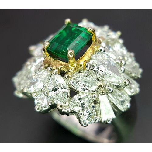 1771 - A W.G.I Certified 18K White Gold, Emerald and Diamond Dress Ring. Central Colombian 1.4ct octagonal ... 