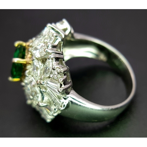 1771 - A W.G.I Certified 18K White Gold, Emerald and Diamond Dress Ring. Central Colombian 1.4ct octagonal ... 