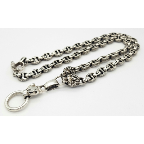 1068 - A STERLING SILVER, PANTHERS HEAD, ANCHOR LINK NECKLACE, WITH SADDLE T BAR CLASP. 22 INCHES LONG, TOT... 