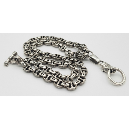 1068 - A STERLING SILVER, PANTHERS HEAD, ANCHOR LINK NECKLACE, WITH SADDLE T BAR CLASP. 22 INCHES LONG, TOT... 