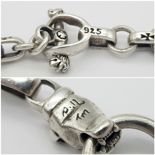 1068 - A STERLING SILVER, PANTHERS HEAD, ANCHOR LINK NECKLACE, WITH SADDLE T BAR CLASP. 22 INCHES LONG, TOT... 