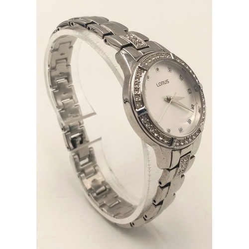 1094 - A LORUS, STONE SET, WHITE DIAL, STEEL BRACELET WATCH. IN FULL WORKING ORDER. S/A 1268 - 1