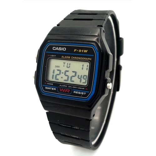 1115 - A CASIO, F - 91W DIGITAL, RUBBER STRAP WATCH. IN FULL WORKING ORDER. S/A 1317 - 1