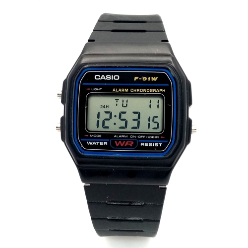 1115 - A CASIO, F - 91W DIGITAL, RUBBER STRAP WATCH. IN FULL WORKING ORDER. S/A 1317 - 1