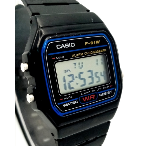 1115 - A CASIO, F - 91W DIGITAL, RUBBER STRAP WATCH. IN FULL WORKING ORDER. S/A 1317 - 1