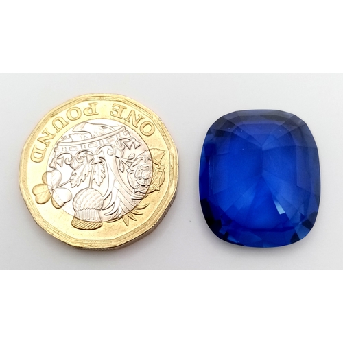 1072 - A 29.44 Ct Blue  Cushion cut Lab-Grown Sapphire. Come in a presentation case.