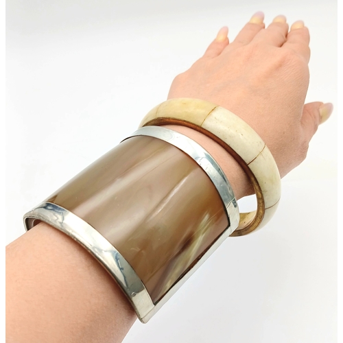 1074 - 2X vintage Bone and Horn bangles. One is cuff bangle with inner length 7cm. The other has 7.4cm diam... 