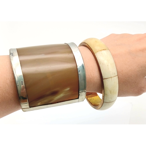 1074 - 2X vintage Bone and Horn bangles. One is cuff bangle with inner length 7cm. The other has 7.4cm diam... 