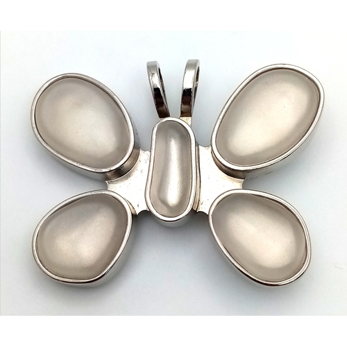 1086 - A large designer Rebecca Collins silver-tone large stone set butterfly pendant. 5 X 7 cm.