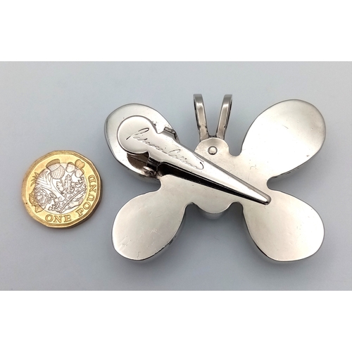 1086 - A large designer Rebecca Collins silver-tone large stone set butterfly pendant. 5 X 7 cm.