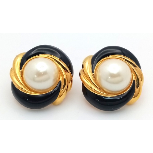1100 - A vintage 1980s pair of designer St John gilded Faux pearl black enamelled clip earrings. New old st... 