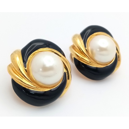 1100 - A vintage 1980s pair of designer St John gilded Faux pearl black enamelled clip earrings. New old st... 