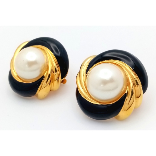 1100 - A vintage 1980s pair of designer St John gilded Faux pearl black enamelled clip earrings. New old st... 