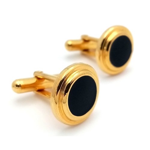 1107 - A pair of gilded black enamelled cufflinks. Please see photos for details.