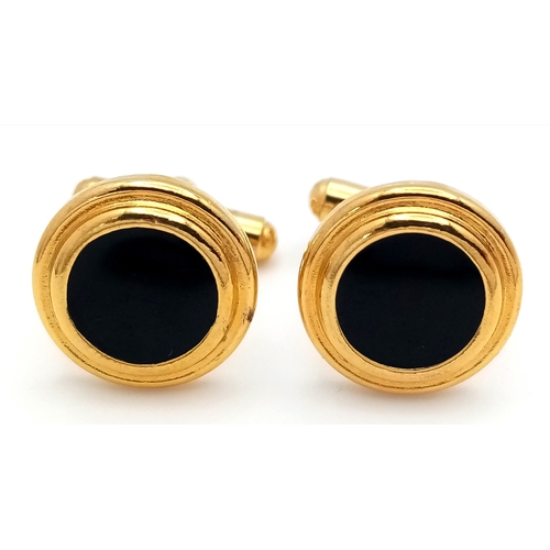 1107 - A pair of gilded black enamelled cufflinks. Please see photos for details.