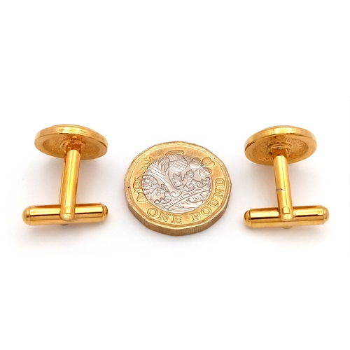 1107 - A pair of gilded black enamelled cufflinks. Please see photos for details.