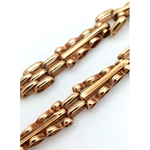13 - A 9K GOLD SLIMLINE GATE BRACELET WITH SAFETY CHAIN .      4.2gms    19cms