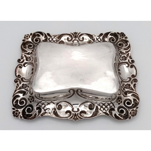 19 - AN ORNATE ANTIQUE SILVER TRUFFLE DISH HALLMARKED CHESTER 1726 HAVING HAND CHASED DESIGNED EDGES .   ... 