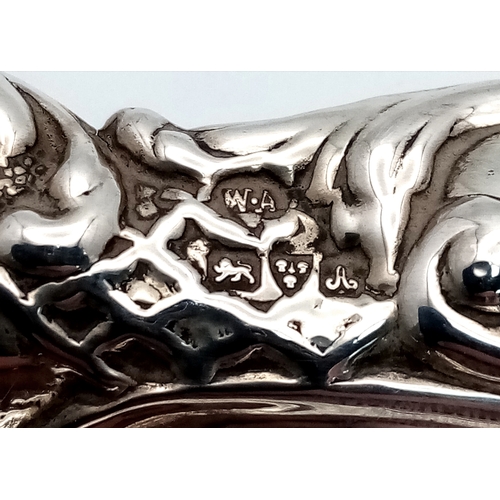 19 - AN ORNATE ANTIQUE SILVER TRUFFLE DISH HALLMARKED CHESTER 1726 HAVING HAND CHASED DESIGNED EDGES .   ... 