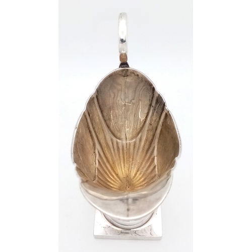 33 - A 1731 GEORGIAN SILVER ANTIQUE HELMET SHAPED CREAM JUG .        51gms    11.5cms